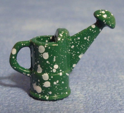 Groene gieter met witte spikkels